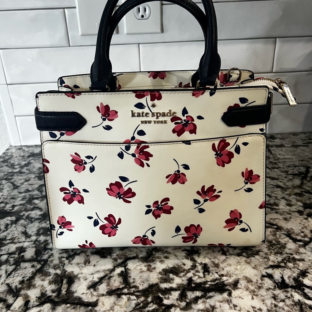 kate spade cream purse with pink floral print and black trim